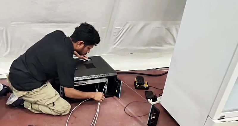 First Option engineer installing network equipment on site